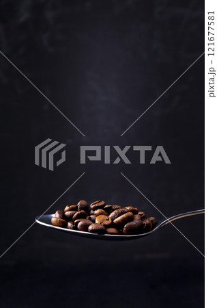 The concept of fragrant hot coffee with spices. Autumn, winter, cold season. Hot drinks. Coffee on a dark background. The concept of fragrant hot coffee with spices. Autumn, winter, cold season. Hot drinks. Coffee on a dark background. 121677581