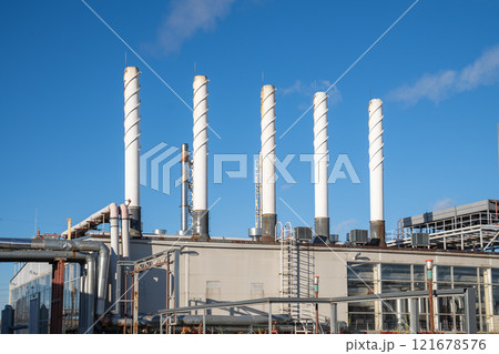 Steam rise from pipes in modern gas boiler house, factory, industrial technology with agriculture Steam rise from pipes in modern gas boiler house, factory, industrial technology with agriculture 121678576