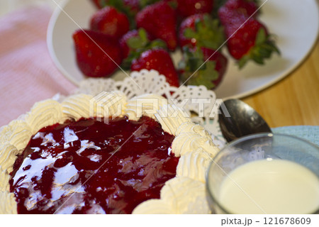 Strawberry cake and strawberry fruits and milk , on the table 121678609