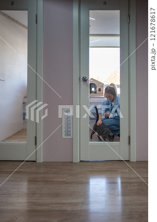 Female staff member in cat room, no walk allowed due to missing vaccination. Health check, care Female staff member in cat room, no walk allowed due to missing vaccination. Health check, care 121678617