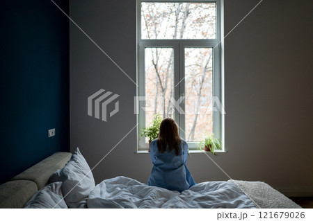 Alone woman sit on bed at home pondering solution trouble, suffer from breakup, divorce, feel unwell 121679026