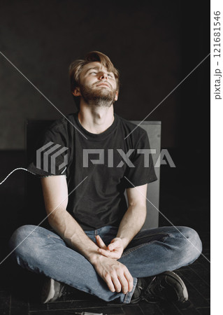 Bad habits problem. Drug addicted man took in dose. He is sitting alone satisfied. Bad habits problem. Drug addicted man took in dose. He is sitting alone satisfied. 121681546
