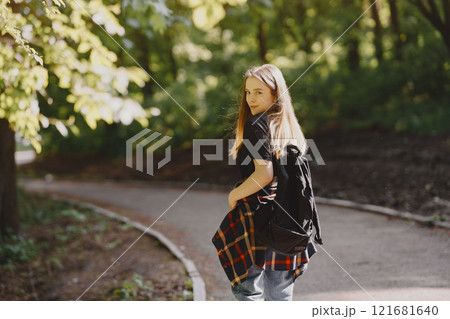 Beautiful girl in a black t-shirt. Woman in a summer forest 121681640