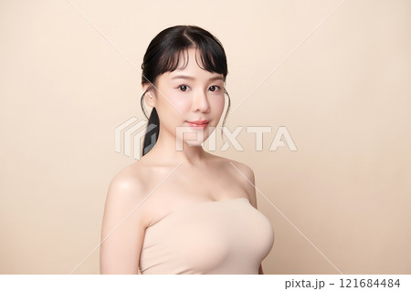 Beautiful young asian woman with clean fresh skin on beige background, Face care, Facial treatment, Cosmetology, beauty and spa, Asian women portrait. 121684484