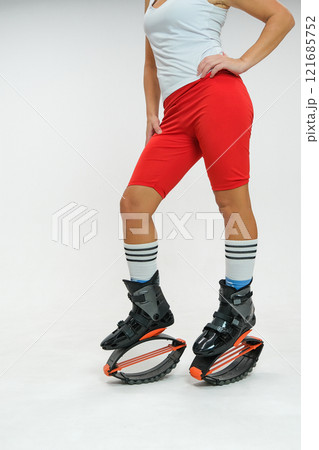 Girl in a New Year's hat and Stylish kangoo shoes 121685752