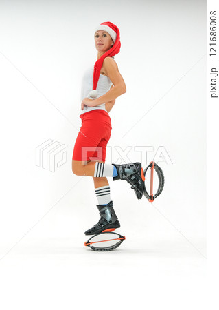 Girl in a New Year's hat and Stylish kangoo shoes Girl in a New Year's hat and Stylish kangoo shoes 121686008