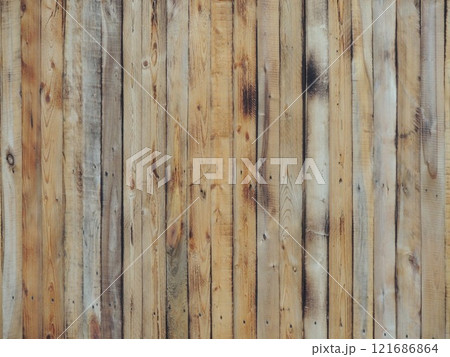texture of a rustic fence made of narrow planks with the effect of burnt wood, with a beautiful pattern of rings and knots, a plank surface with vertical boards texture of a rustic fence made of narrow planks with the effect of burnt wood, with a beautiful pattern of rings and knots, a plank surface with vertical boards 121686864