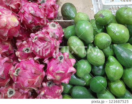 dragon fruit and avocado on display at the fruit shop 121687525