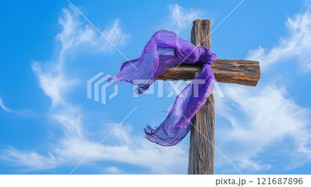 Purple scarf is tied to a wooden cross Purple scarf is tied to a wooden cross 121687896