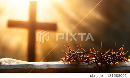 Cross is shown with a crown of thorns on top of it 121688005