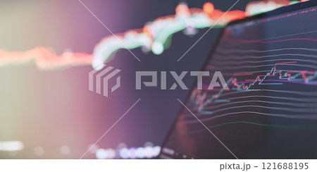 Abstract Trading Screen with Candlestick Chart and Colorful Market Trends in Soft Focus 121688195