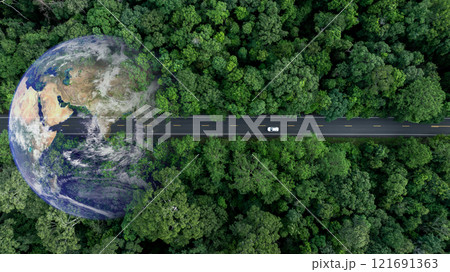 Aerial view EV electric vehicle car on middle green tree forest road globe earth planet, EV car electric vehicle car alternative sustainable energy eco power, Green business ecosystem environment. 121691363