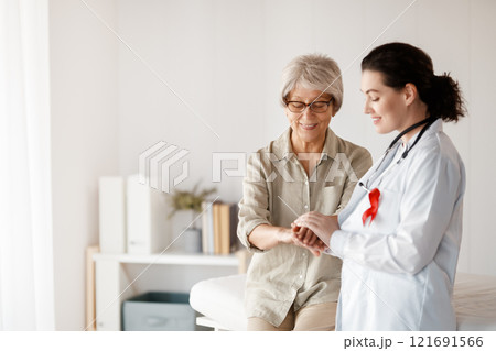 patient and a doctor in medical office 121691566