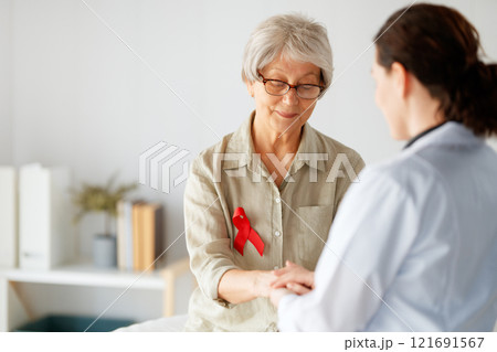 patient and a doctor in medical office 121691567