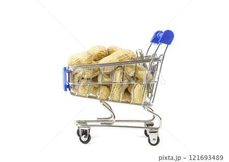 unshelled peanuts in the supermarket trolley, isolated on white background 121693489