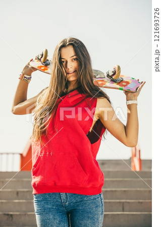 Urban skate girl with skateboard. 121693726