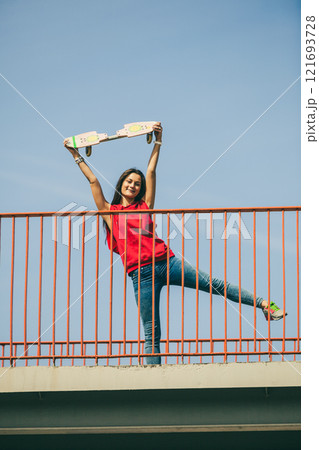 Urban skate girl with skateboard. 121693728
