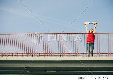 Urban skate girl with skateboard. 121693731