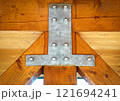 iron sheet connects wooden beams 121694241