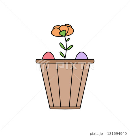A flower pot with a flower and two eggs in it 121694940