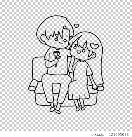 A boy and girl are sitting on a couch and holding a rose 121695058