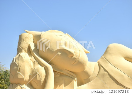 ancient reclining Buddha at Lokaya Sutha after renovate painting colors from white to yellow ancient reclining Buddha at Lokaya Sutha after renovate painting colors from white to yellow 121697218