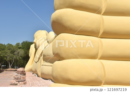 ancient reclining Buddha at Lokaya Sutha after renovate painting colors from white to yellow ancient reclining Buddha at Lokaya Sutha after renovate painting colors from white to yellow 121697219
