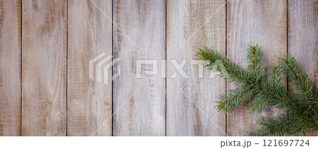 Christmas fir twig, rustic wooden board ,copy space.Wide New Year wooden forest banner.Winter branch of a Christmas tree 121697724