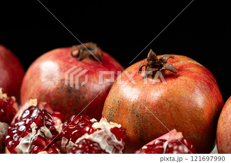 Ripe pomegranates, peeled and whole, the concept of benefits and vitamins in fruit. Ripe pomegranates, peeled and whole, the concept of benefits and vitamins in fruit. 121697990