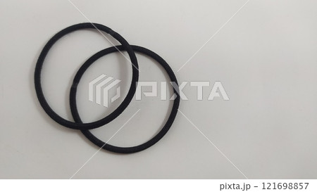 Subject shot of black scrunchies. rubber band. The vogue accessories are isolated on the white background. Subject shot of black scrunchies. rubber band. The vogue accessories are isolated on the white background. 121698857