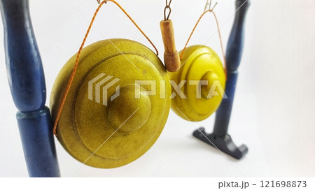 Miniature Gong, a traditional Javanese musical instrument. Miniature Indonesian Javanese Traditional Gamelan Music Instruments in White Isolated Background 121698873
