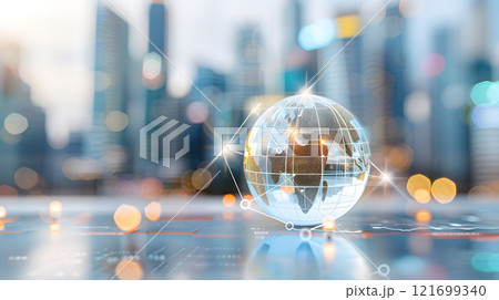 Globe is on a table with a city in the background 121699340