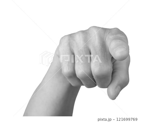 Pointing gesture. Senior woman s gray, wrinkled hand with the index finger extended, indicating 121699769