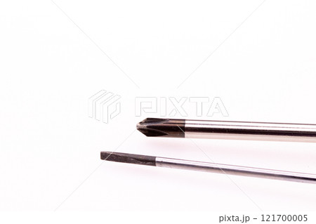 Two tip of Screwdriver close up on middle white background Two tip of Screwdriver close up on middle white background 121700005