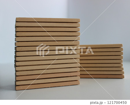 Two pallets of beige ceramic tiles isolated on white stock photo Two pallets of beige ceramic tiles isolated on white stock photo 121700450