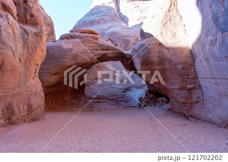 Sand Dune Arch in Arches National Park, Utah, Framed by Scenic Rock Formations. Sand Dune Arch in Arches National Park, Utah, Framed by Scenic Rock Formations. 121702202