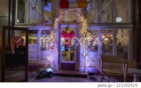 Cafe bar on Deribasovskaya 12 in Odessa. Original design of the entrance to a cafe bar on the central street in Odessa. Cafe bar on Deribasovskaya 12 in Odessa. Original design of the entrance to a cafe bar on the central street in Odessa. 121702525