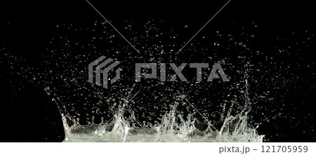 Crown water to object make curve drop explosion in ripple motion. Black background isolated. Crown Water splash on object to create shape form fluttering in droplet and wave. Crown water to object make curve drop explosion in ripple motion. Black background isolated. Crown Water splash on object to create shape form fluttering in droplet and wave. 121705959