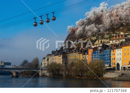 Cable cars over river and bridge in Grenoble in autumn Cable cars over river and bridge in Grenoble in autumn 121707168