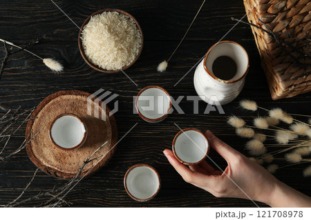 Japanese rice tincture, an alcoholic drink, on a dark background. Japanese rice tincture, an alcoholic drink, on a dark background. 121708978