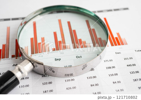 Magnifying glass on charts graphs paper. Financial development, Banking Account, Statistic, Investment Analytic research data economy. Magnifying glass on charts graphs paper. Financial development, Banking Account, Statistic, Investment Analytic research data economy. 121710802