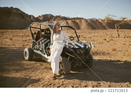 Woman tourist on quad bike ATV safari with desert background of Sharm El Sheikh Egypt Woman tourist on quad bike ATV safari with desert background of Sharm El Sheikh Egypt 121711613