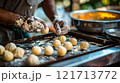Diwali, Cook shaping dough into small balls 121713772