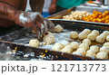 Diwali, Cook shaping dough into small balls 121713773