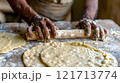 Diwali, Dough being rolled out to make puris 121713774