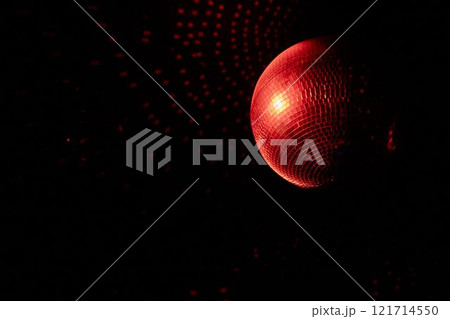 A Disco Ball Shining Red Light, Creating an Energetic Atmosphere Perfect for Celebrating 121714550
