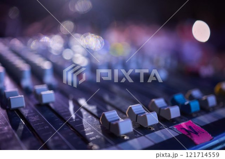 This is a professional audio mixing console that features colorful faders for enhanced usability This is a professional audio mixing console that features colorful faders for enhanced usability 121714559