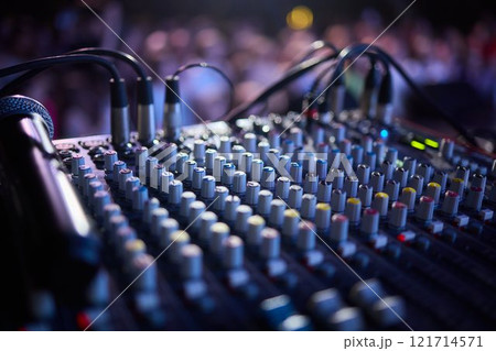 This is a professional audio mixing console that features colorful faders for enhanced usability This is a professional audio mixing console that features colorful faders for enhanced usability 121714571