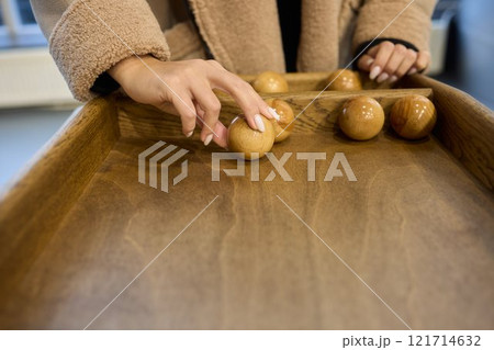 Enjoy a Classic Shuffleboard Game with a beautifully crafted Wooden Board and Puck for fun 121714632