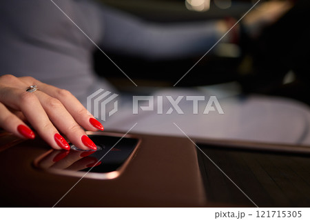 To start a car, the engine is initiated by turning a key in the ignition switch with the hand To start a car, the engine is initiated by turning a key in the ignition switch with the hand 121715305